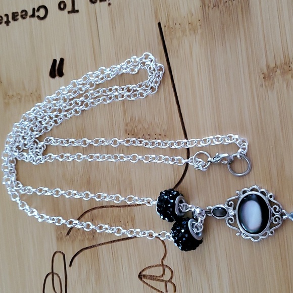 This a 17 inche necklace with a beautiful charm . - Picture 2 of 3